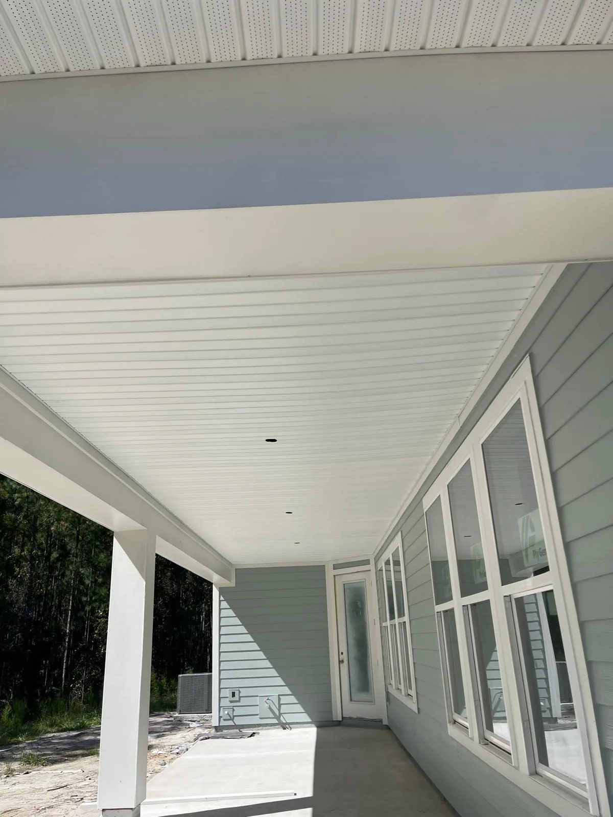 White porch ceiling with clean trim